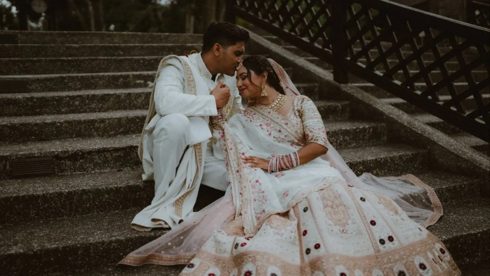 Coordinated bridal lehenga and groom sherwani for an Indian couple in Singapore