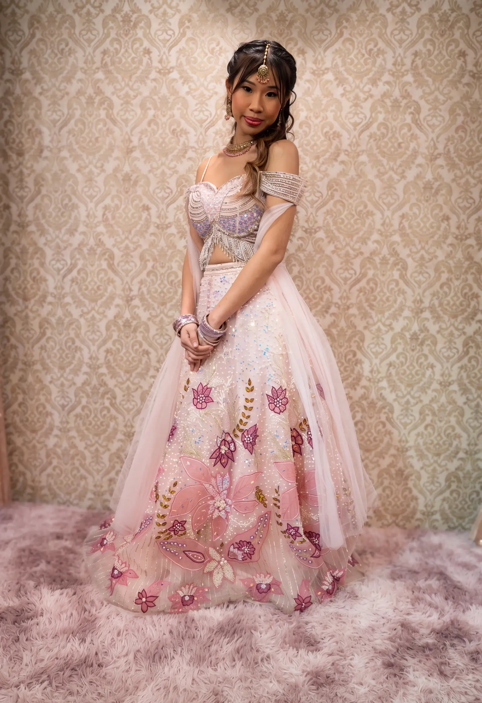 Pink floral lehenga styled by GlamourdollSG in a studio photoshoot