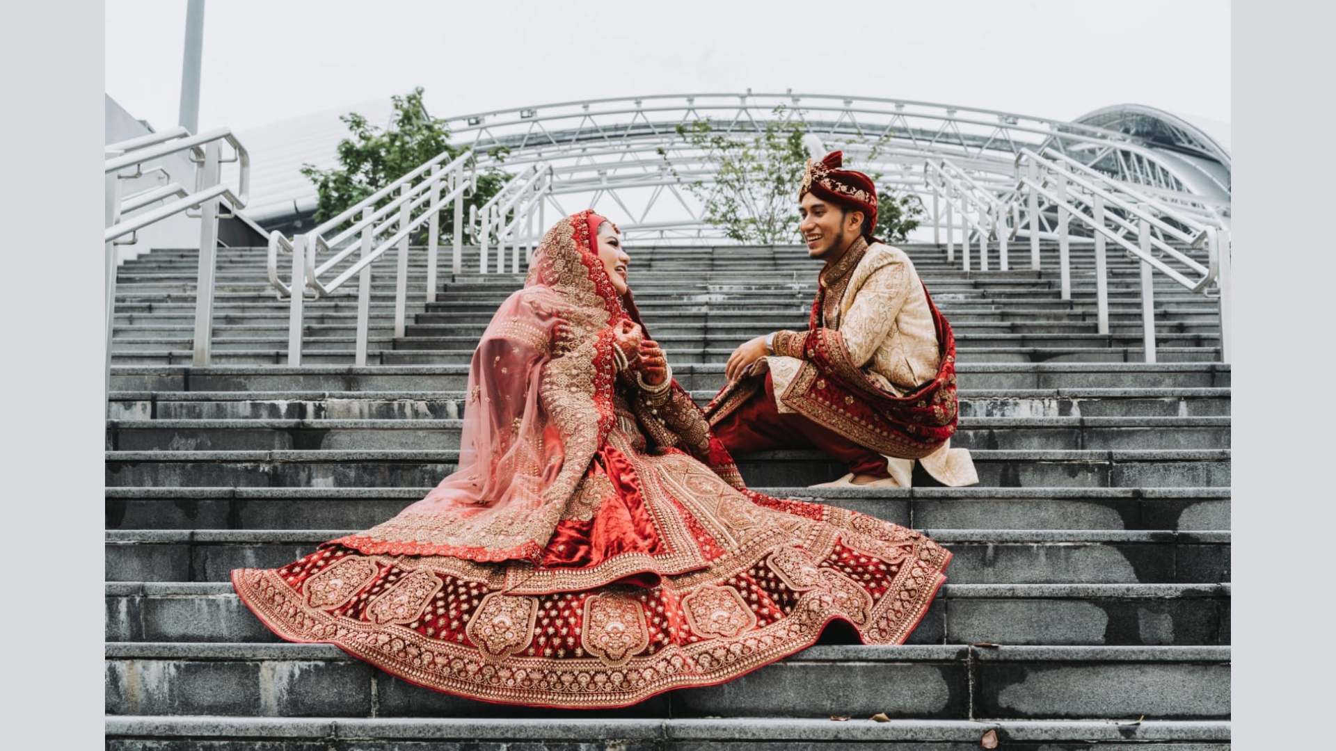 Red and gold coordinated bridal couple set for traditional Singapore weddings