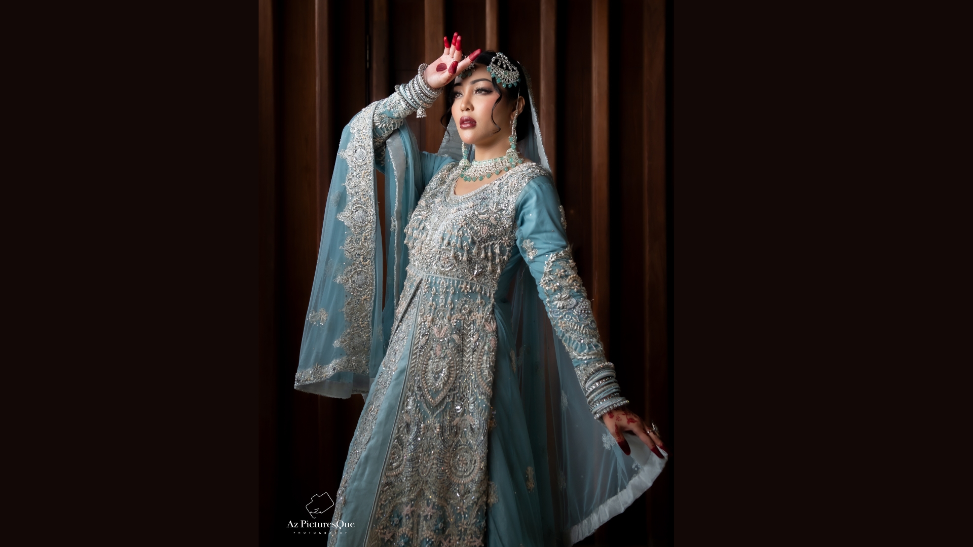 Red traditional bridal lehenga with gold embroidery for Singapore weddings