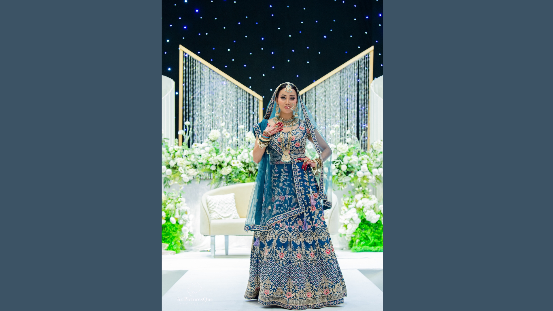 Burgundy velvet bridal lehenga with traditional motifs