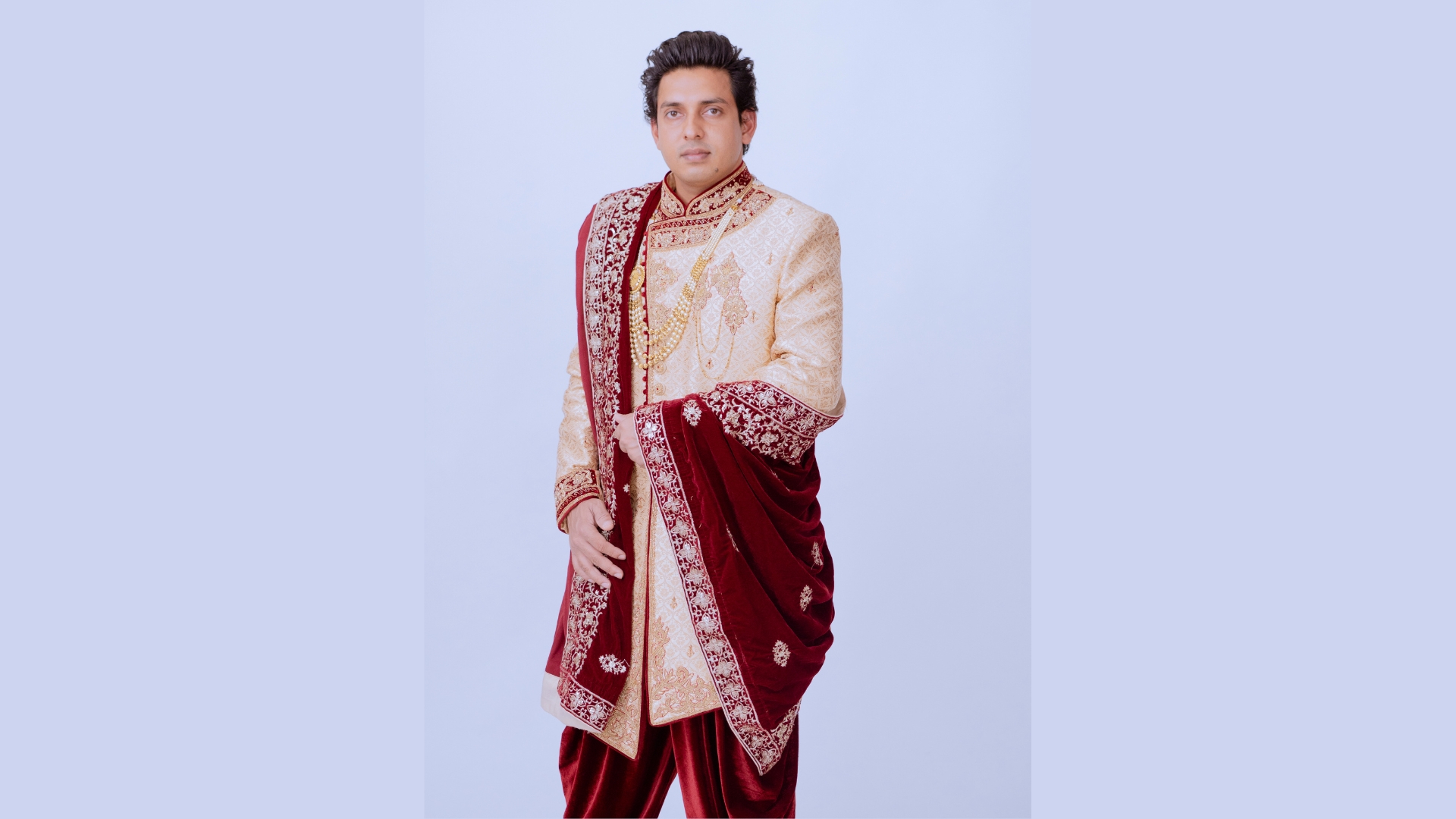 Cream silk sherwani with zari work for traditional wedding celebrations